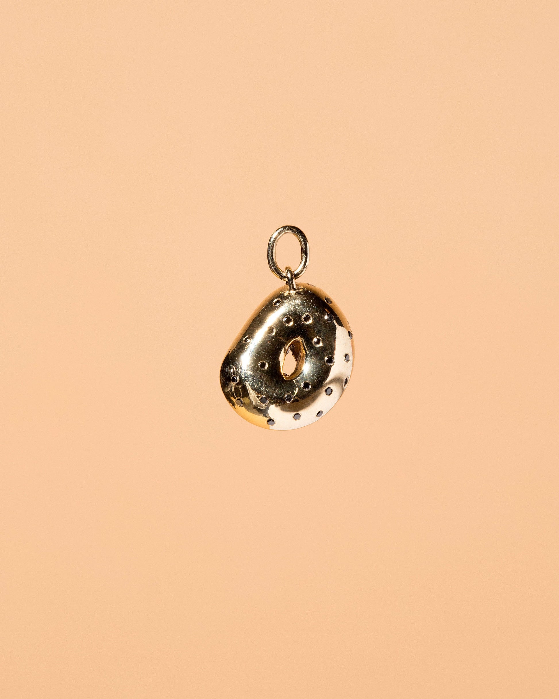  Poppy Seed Bagel Charm with Cream Cheese & Chives on light color background.