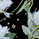 product_details::Product photo of Cluster Stud Earrings on a light color background.