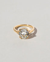 Cushion Cut Diamond Solitaire Ring on light color background.