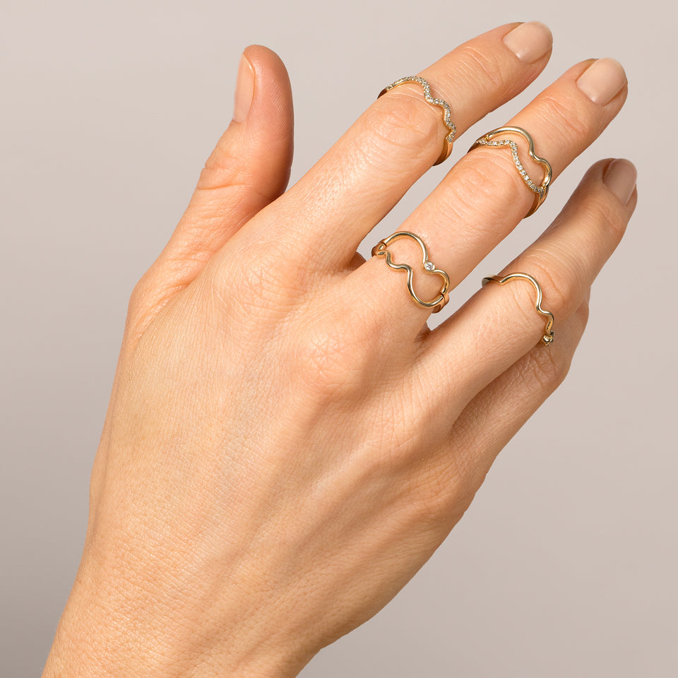 product_details::Yellow Gold Squiggle Bands on model.