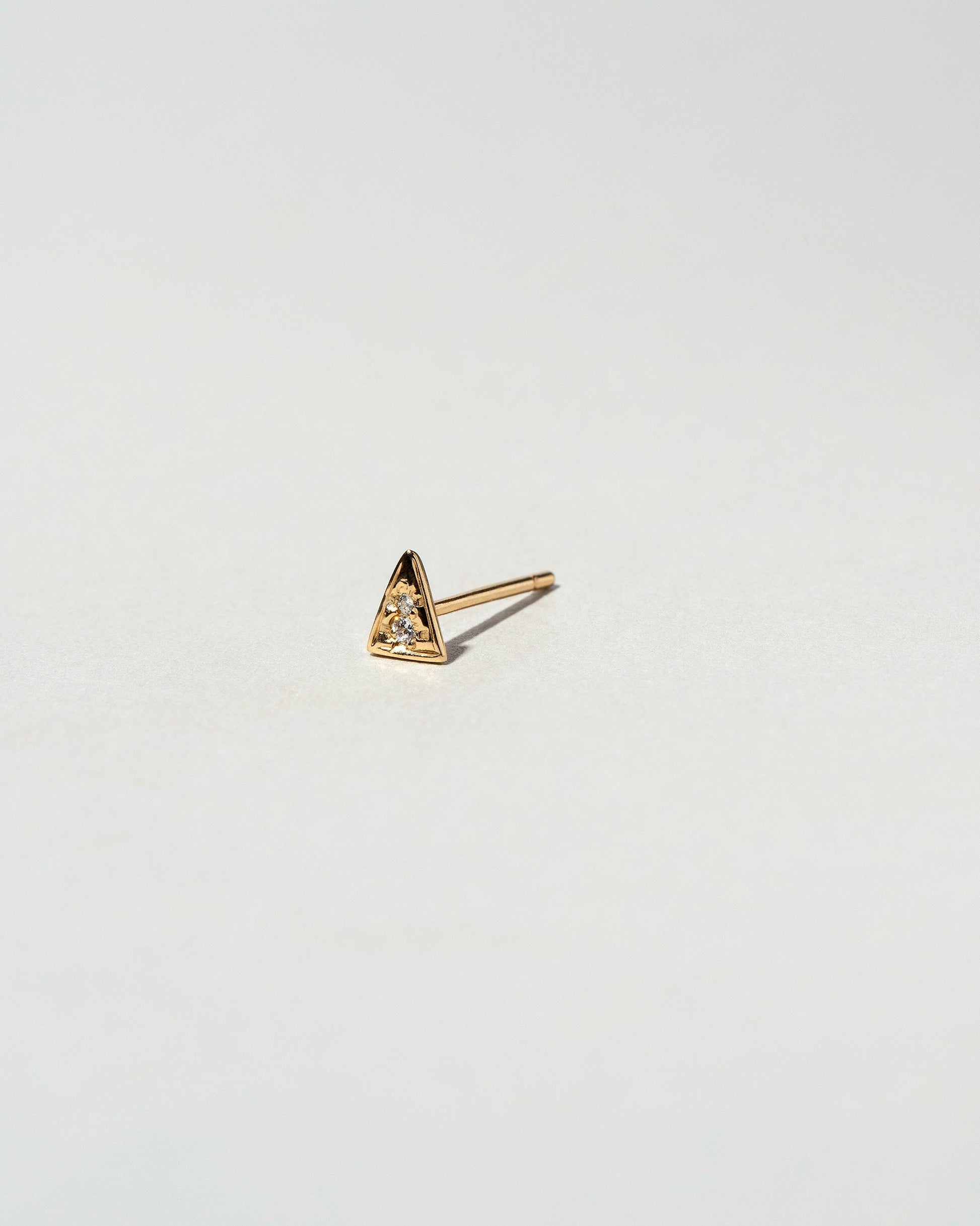  Triangle Single Stud on light color background.