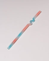  Misha Kahn Blue and Pink Suck It Up Glass Straw on light color background.