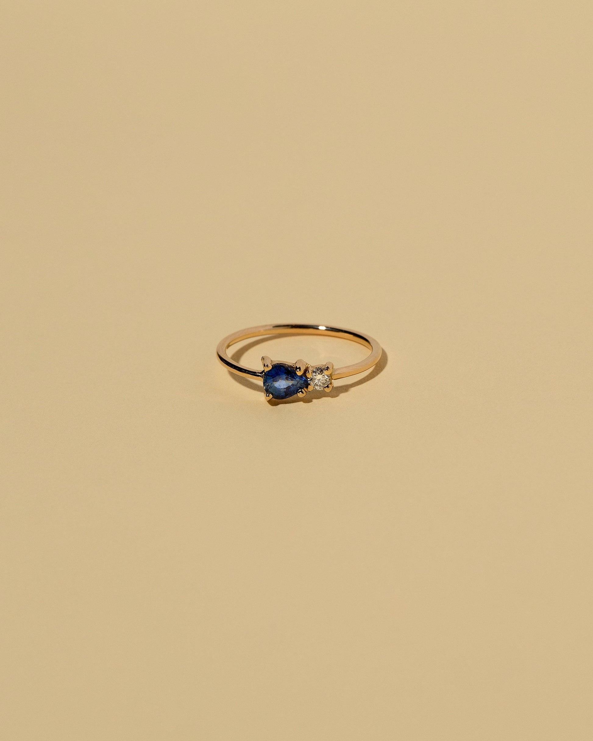  Teardrop Ring - Blue Sapphire on light color background.