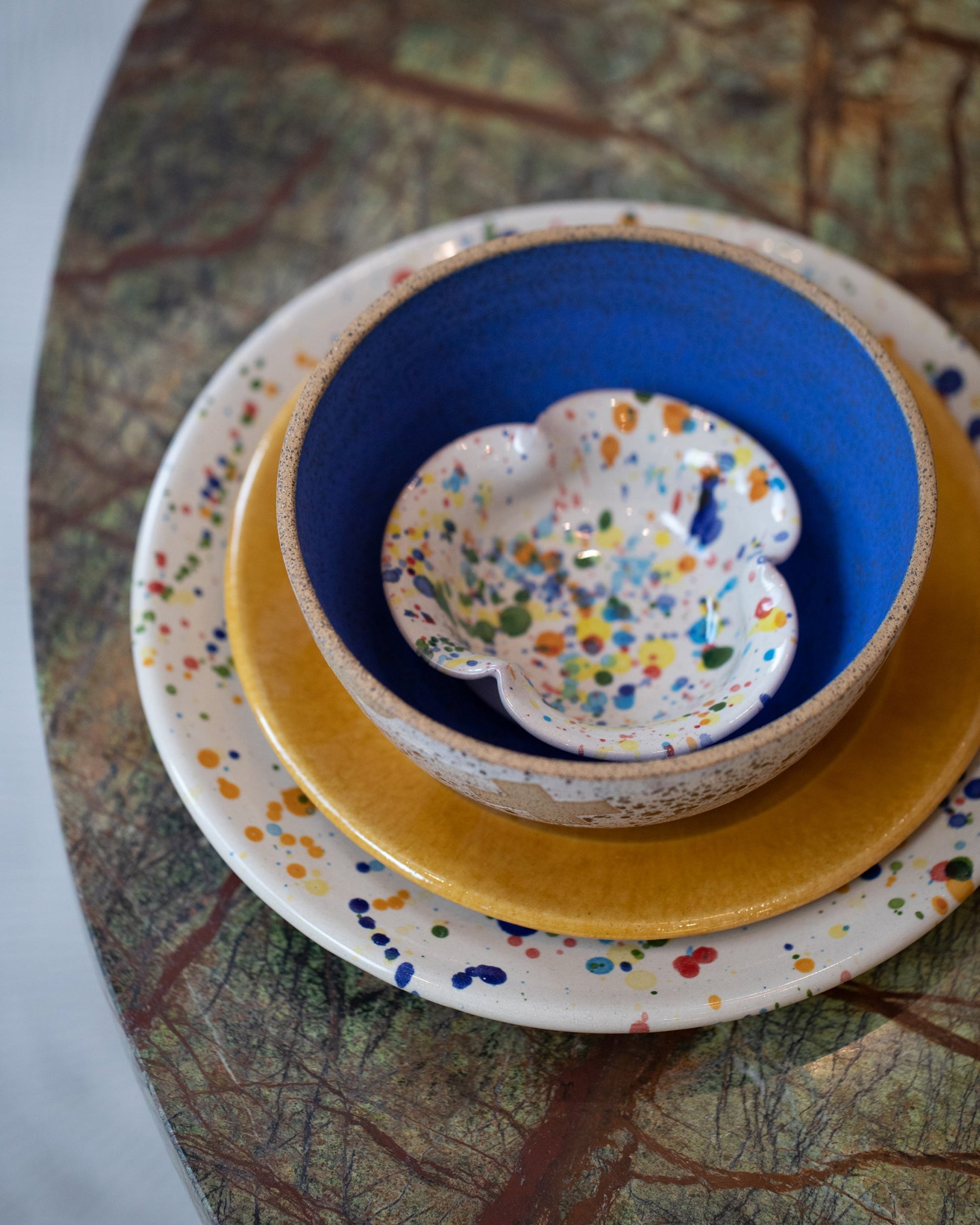 Styled image featuring the La Ceramica Vincenzo Del Monaco Small Scalloped Dish.