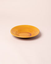 La Ceramica Vincenzo Del Monaco Caramel Yellow Shallow Bowl on light color background.
