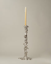 POLSPOTTEN Silver Large Drip Candle Holder on light color background.