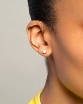 White Diamond Sun & Moon Stud Earrings on model.