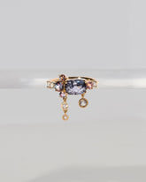  Nivithigala Sapphire Cluster Ring on light color background.