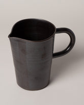 Closeup detail of the Eric Bonnin Gunmetal Kam Pitcher on light color background.