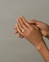 Five Triangle Ring - White Opal on model.