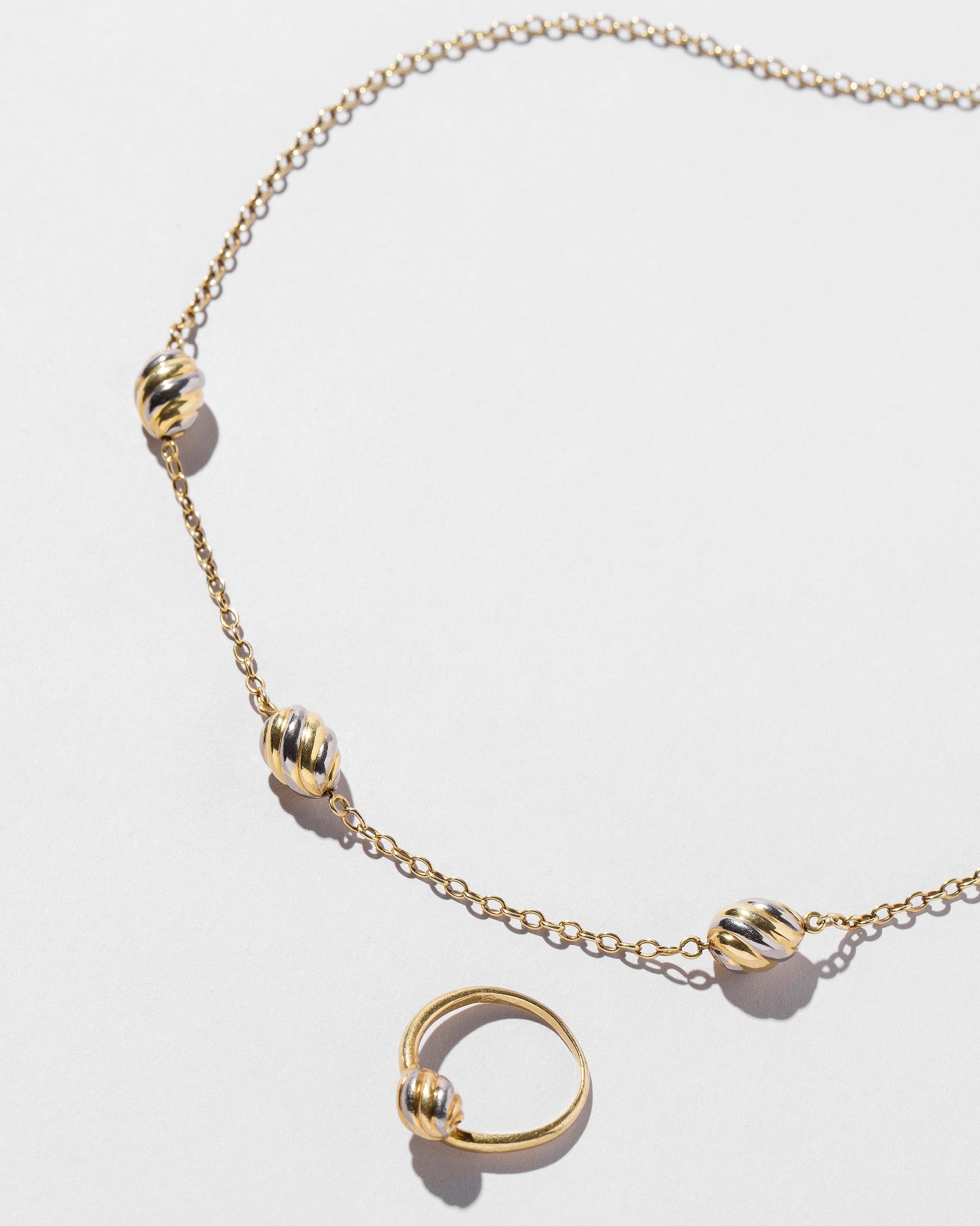  Cartier Necklace & Ring Set on light color background.