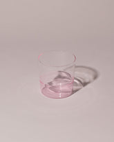 Ichendorf Milano Pink/Clear Light Colore Water Glass on light color background.