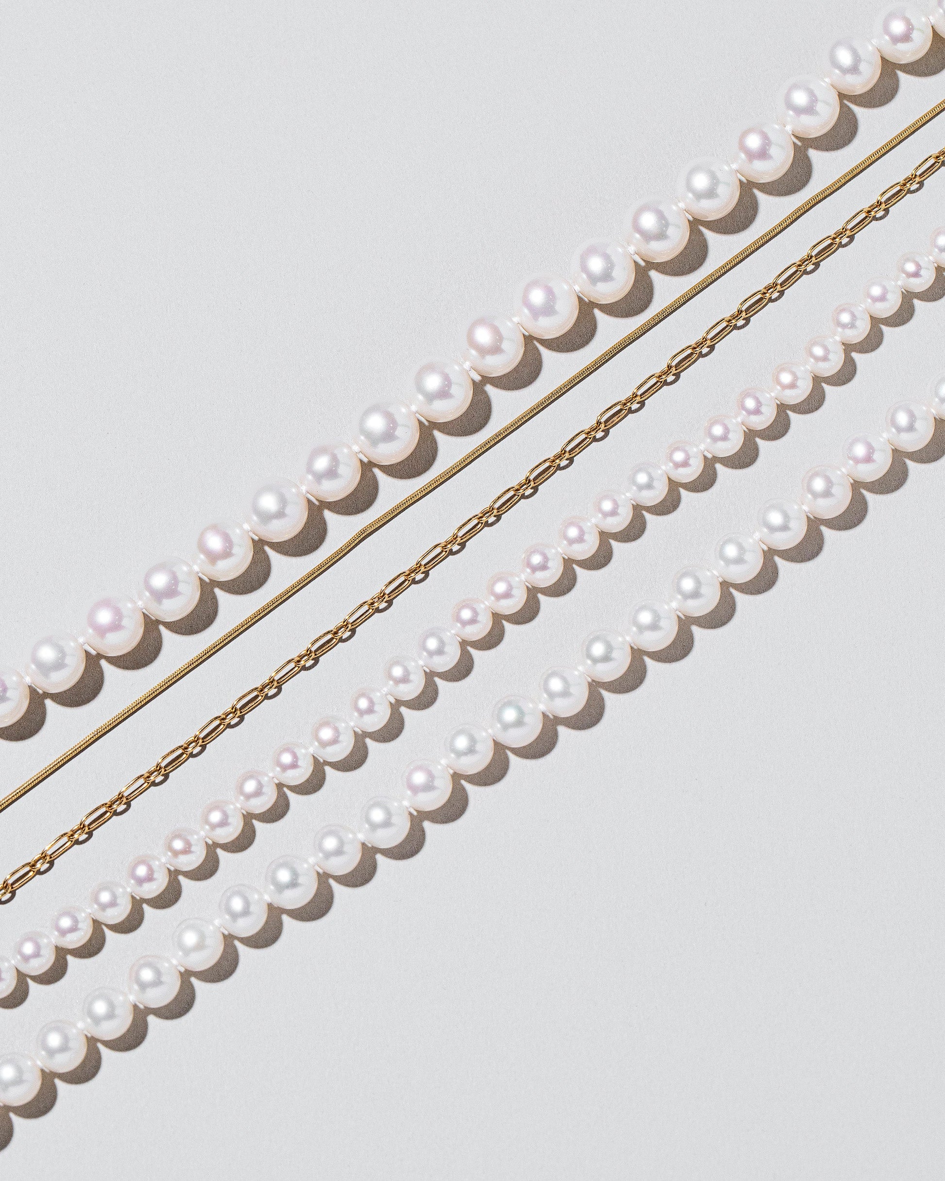  Layered Pearl Necklace on light color background.