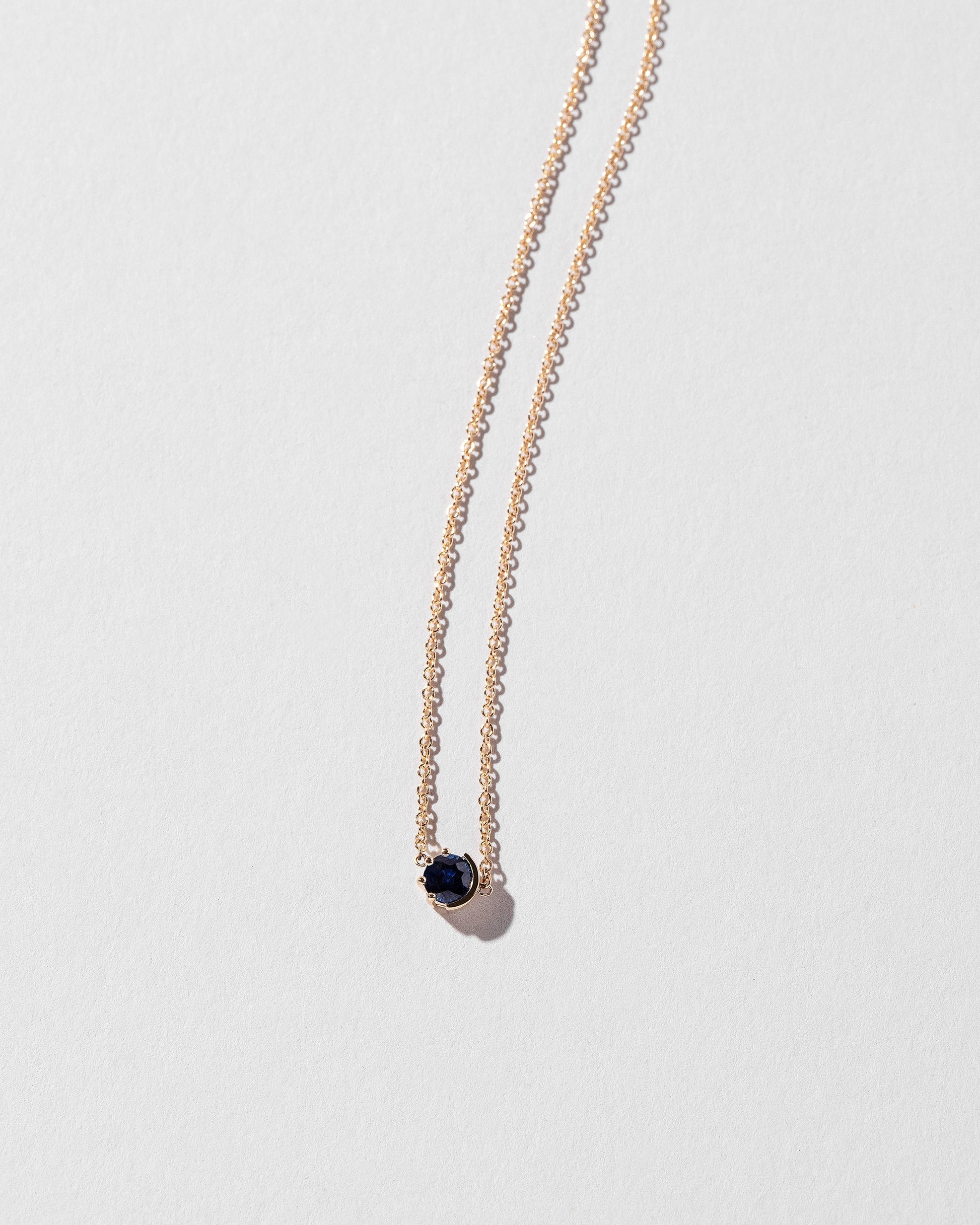  Sun & Moon Necklace - Sapphire on light color background.