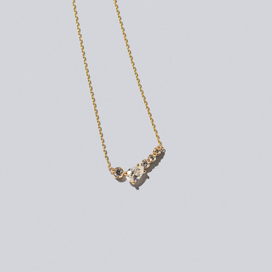 product_details:: Teardrop Necklace - White Diamonds on light color background.