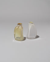 Group of BaleFire Glass Small Smoke and Small Vanilla Suspension Vases on light color background.
