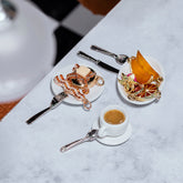 product_details::Styled image of the Tall Stack Pancake Charm, Orange Slice Charm and Avocado Toast Charm.