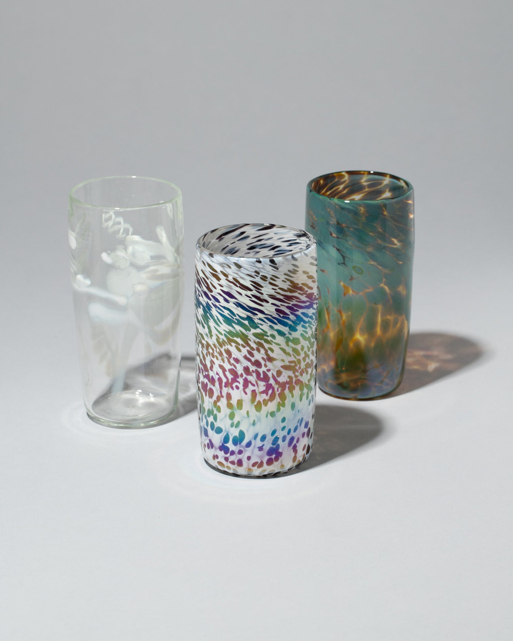 Group of Sirius Glassworks White Nassau Tumblers on light color background.