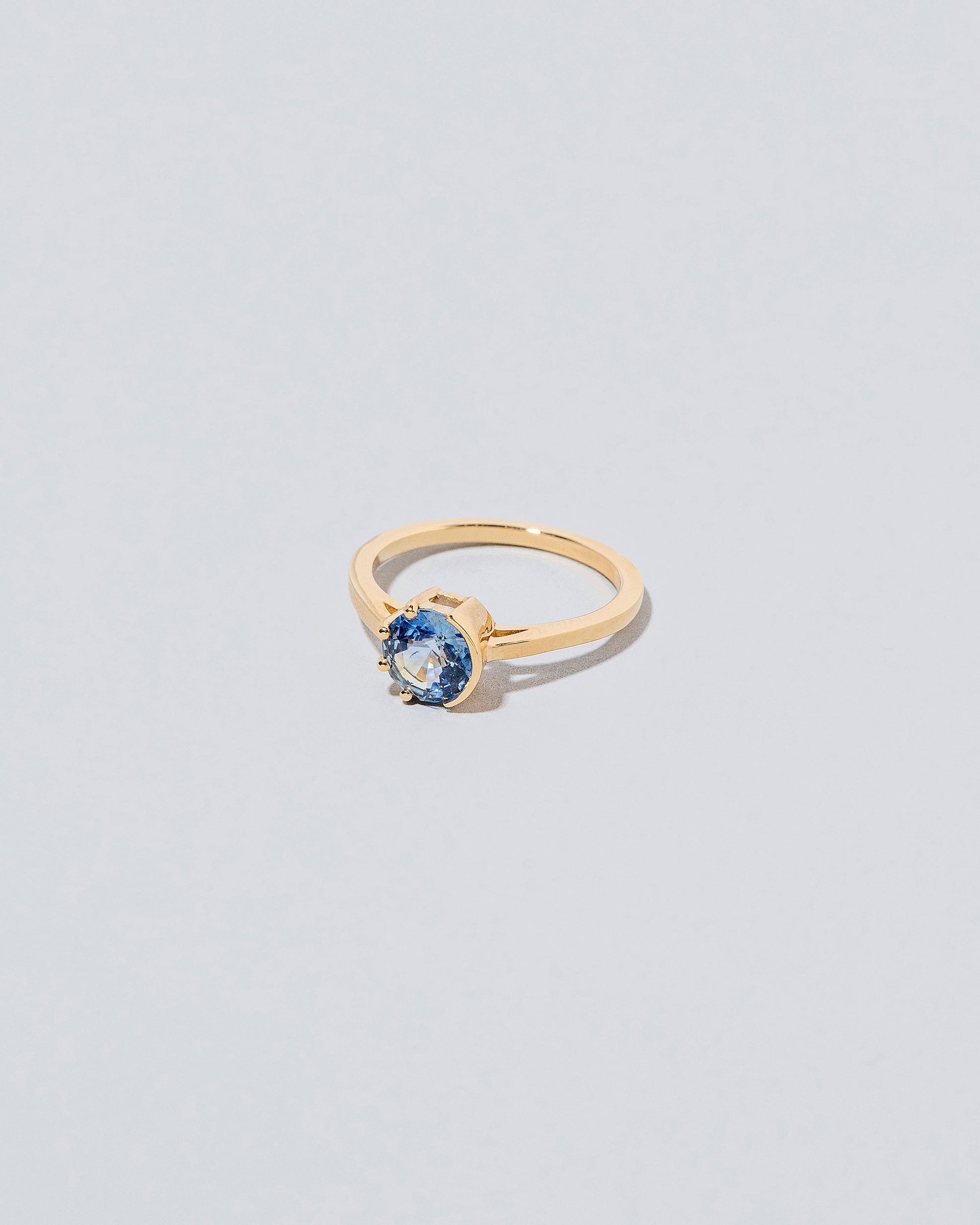 Sun & Moon Ring - Bicolor Sapphire on light color background.