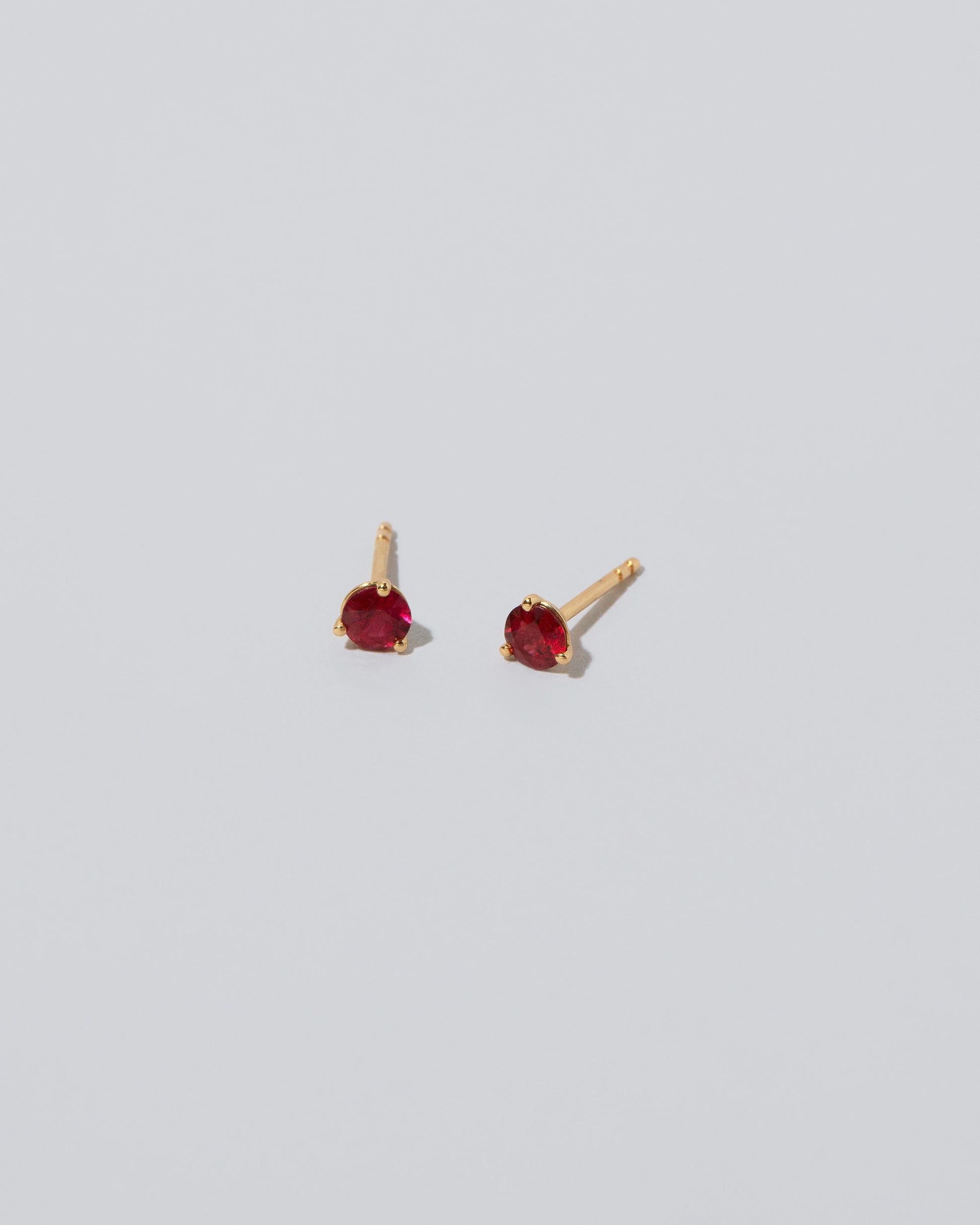 Martini Stud Earrings - Ruby on light color background.