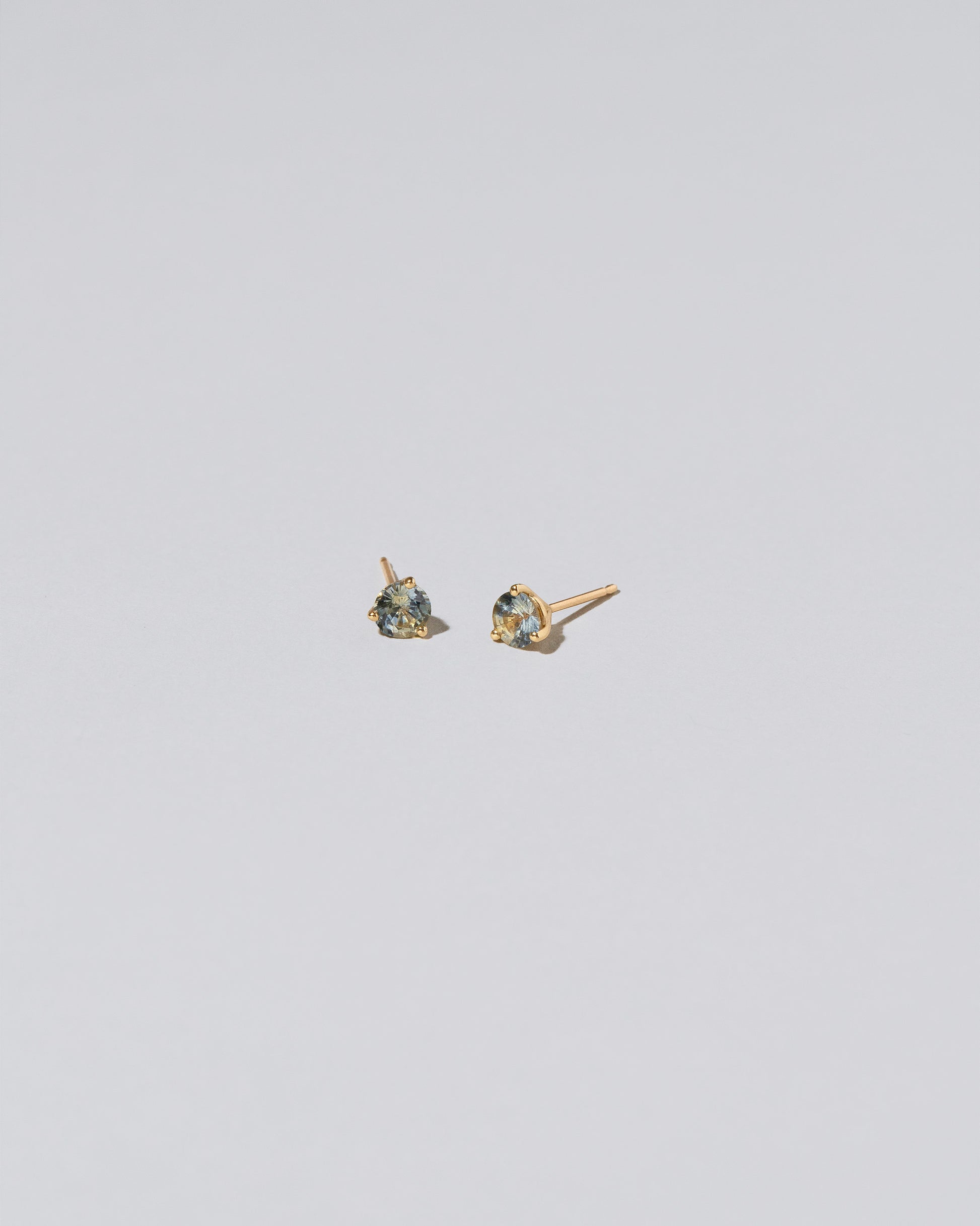 Prodcut photo of Martini Stud Earrings - Blue & Yellow Sapphire on light color background