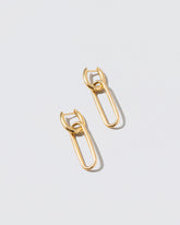 Link Huggie Hoop Earrings on light color background.