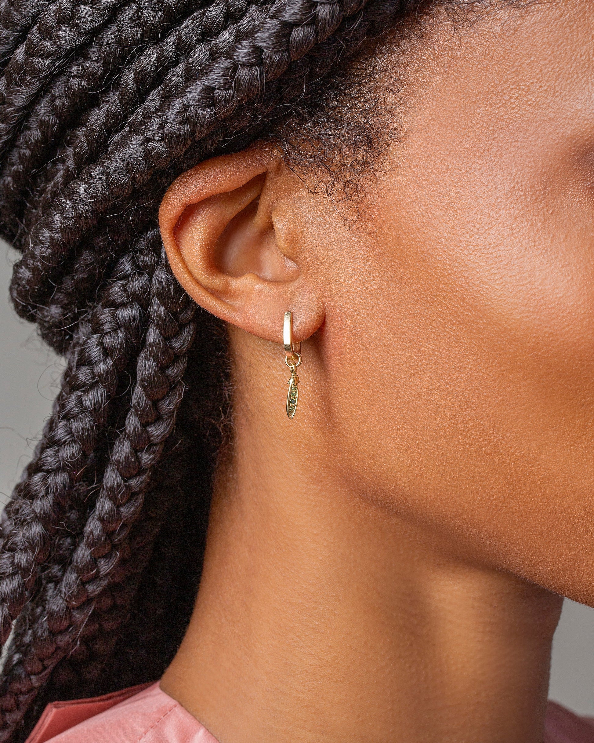 Snap Pea Charm show earring, worn by model.