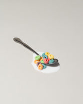  Spills Spoon on light color background.