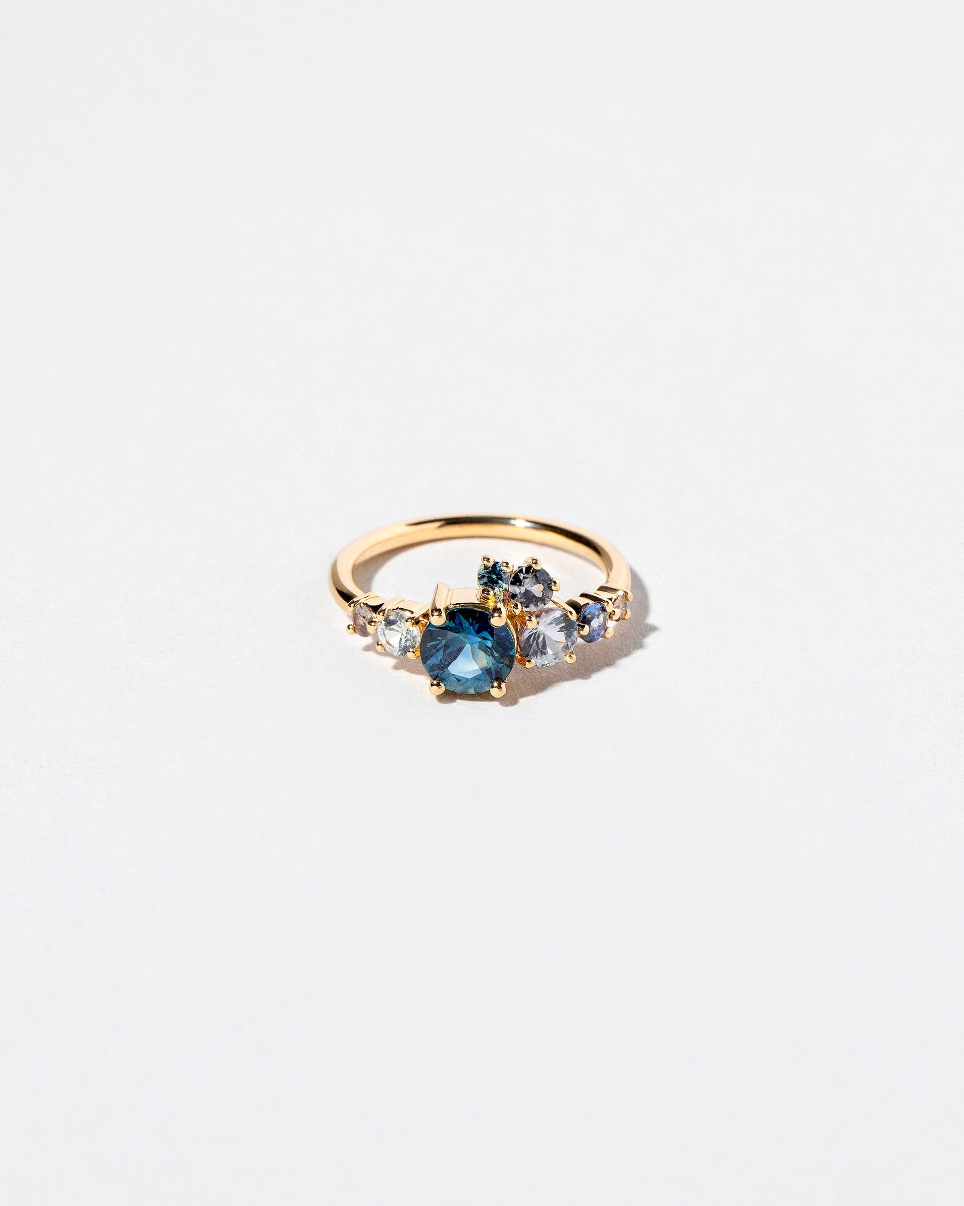 Luna Ring - Blue Sapphire on light color background.