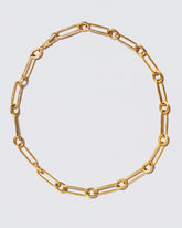 Link Necklace on light color background.