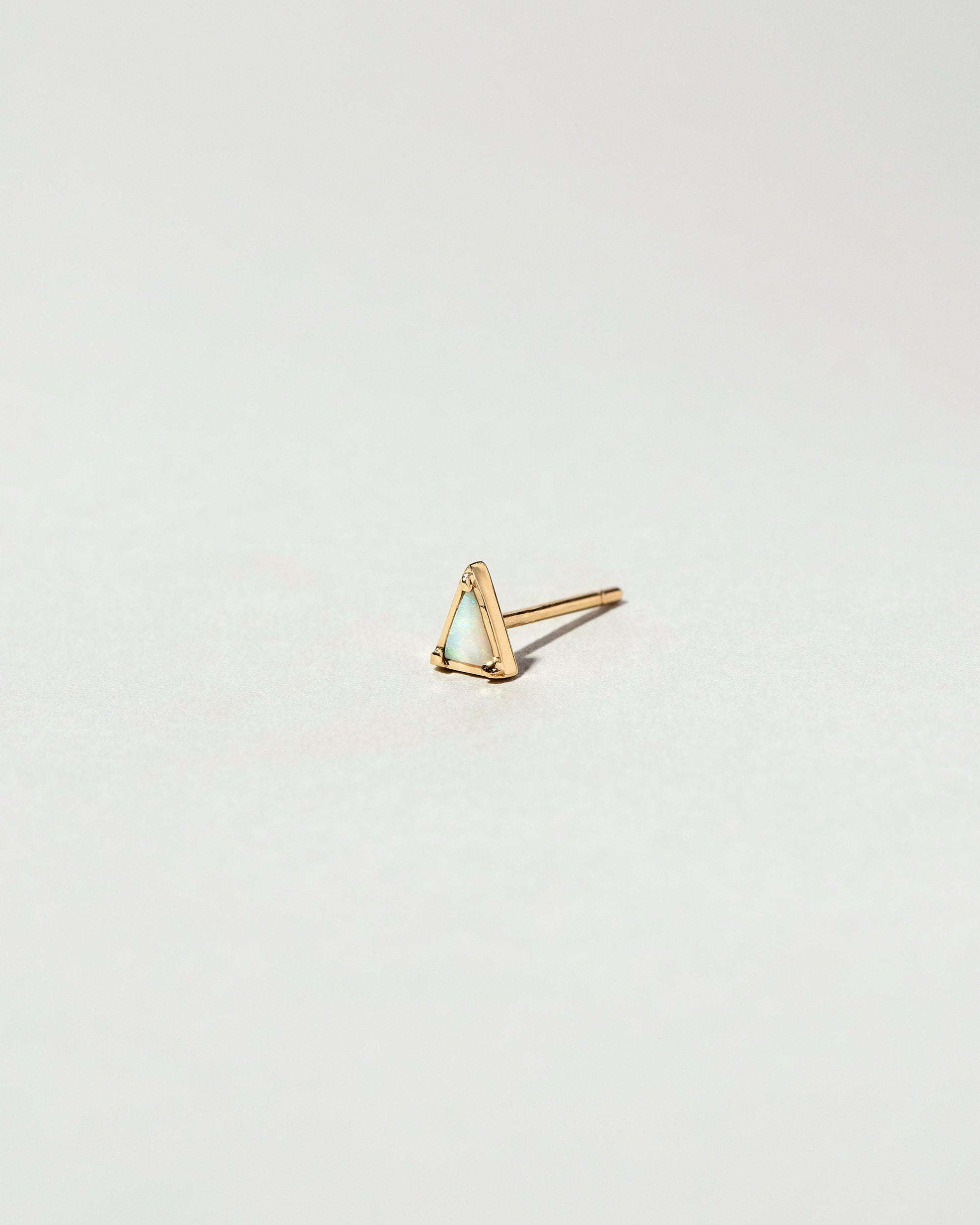  Triangle Single Stud on light color background.