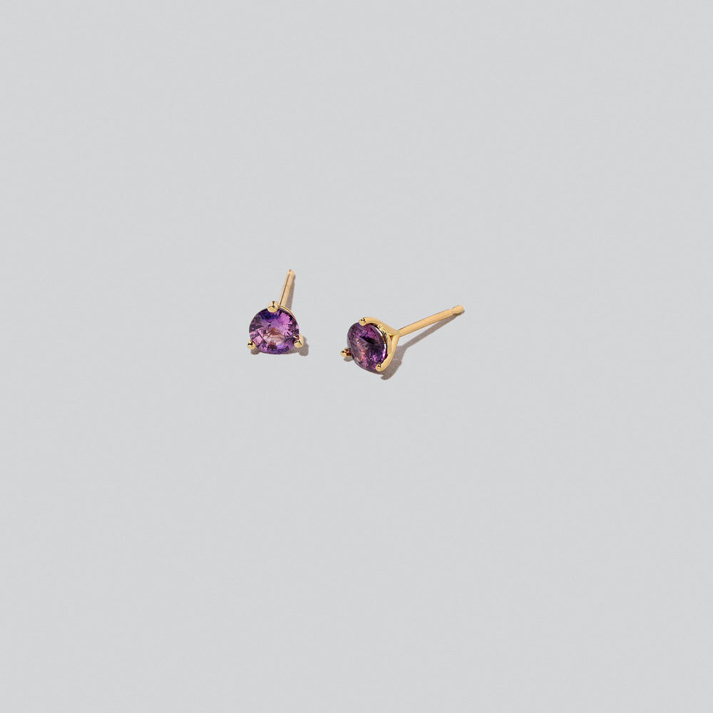 product_details::Martini Stud Earrings on light colored background.