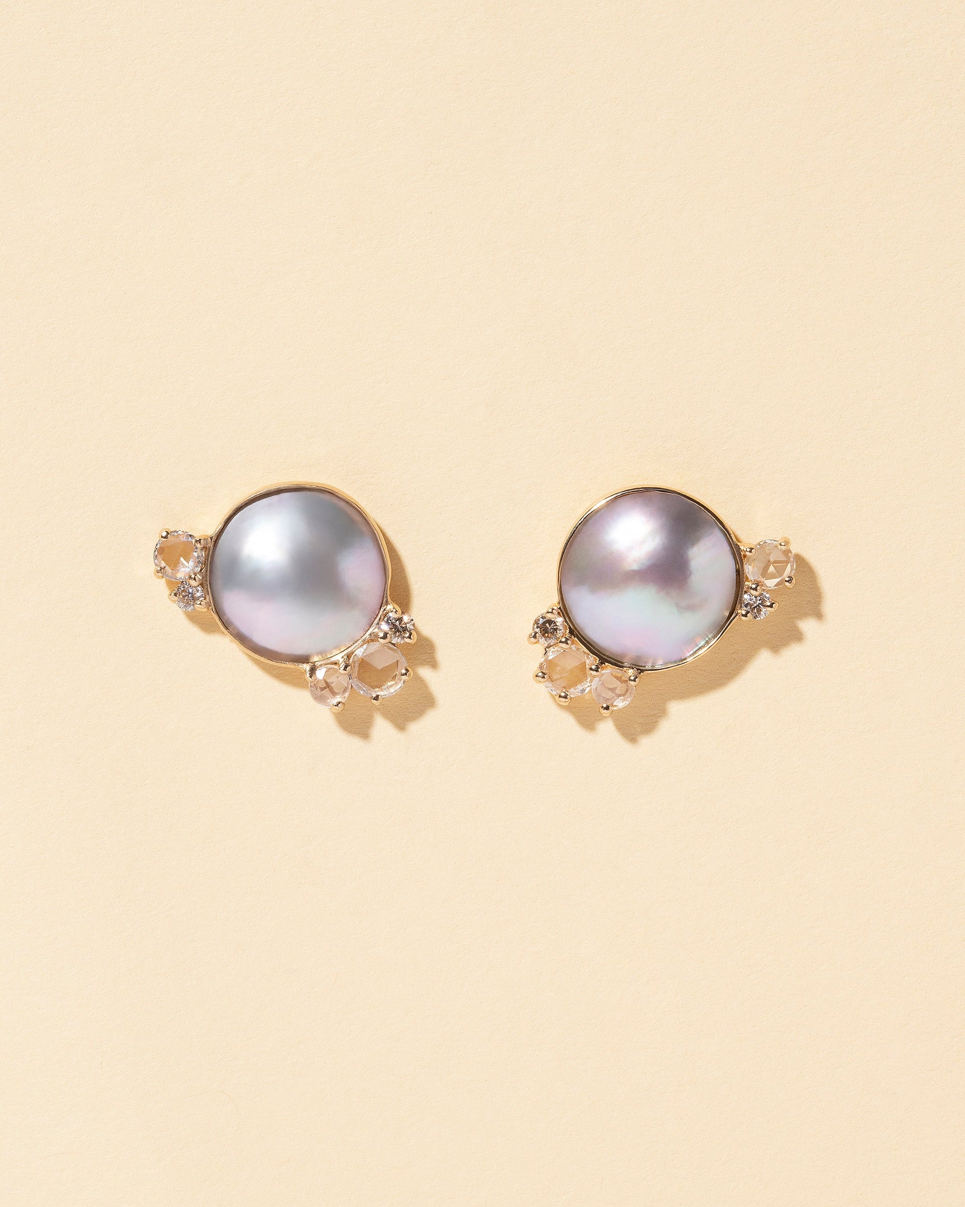  Mabe Pearl Cluster Earrings on light color background.