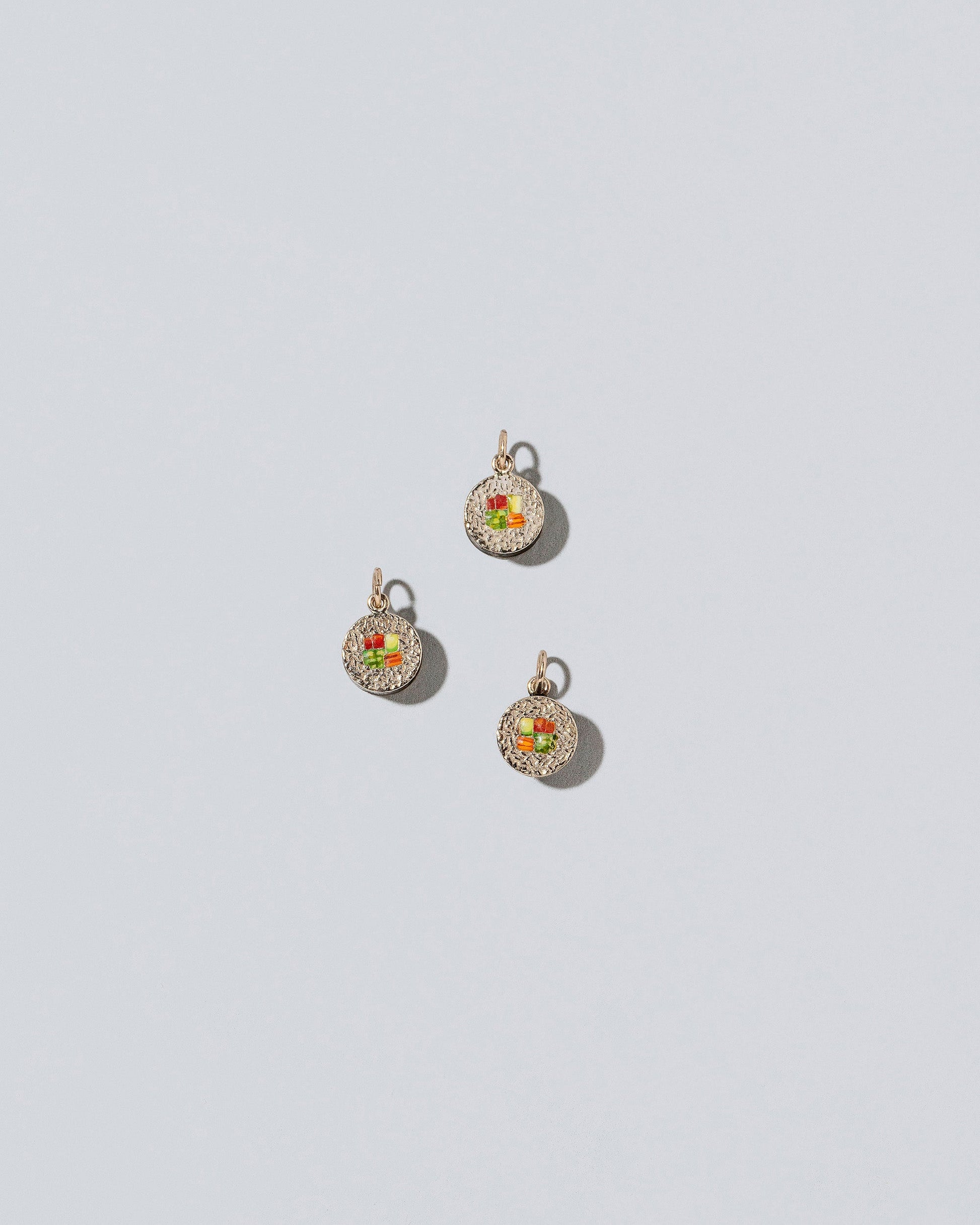  Sushi Charms on light color background.