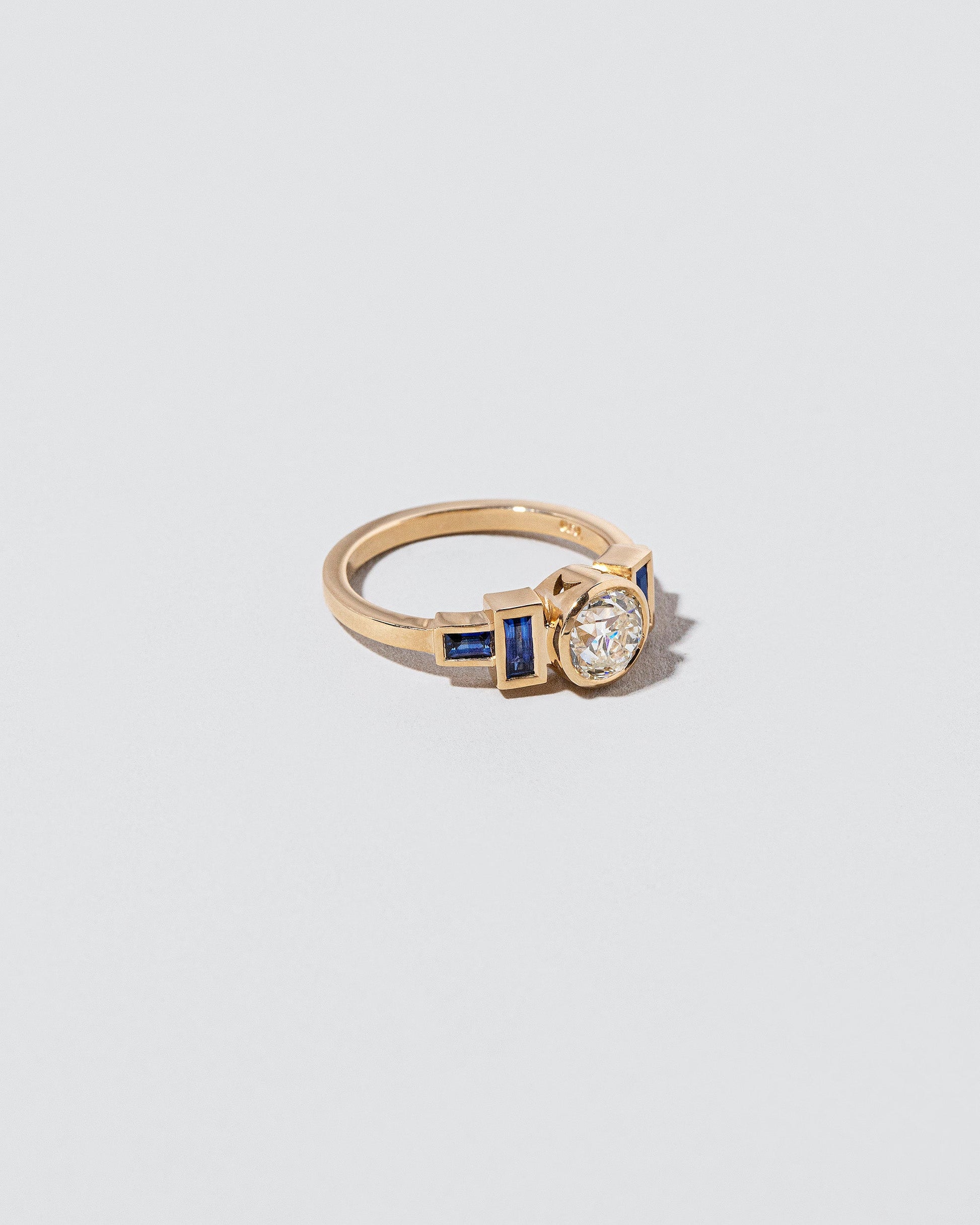  Third Eye Ring - White Diamond & Blue Sapphire on light color background.