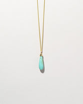  Turquoise Drop Pendant on light color background.