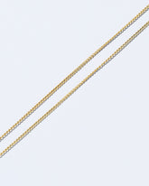  Petite Curb Chain Necklace on light color background.