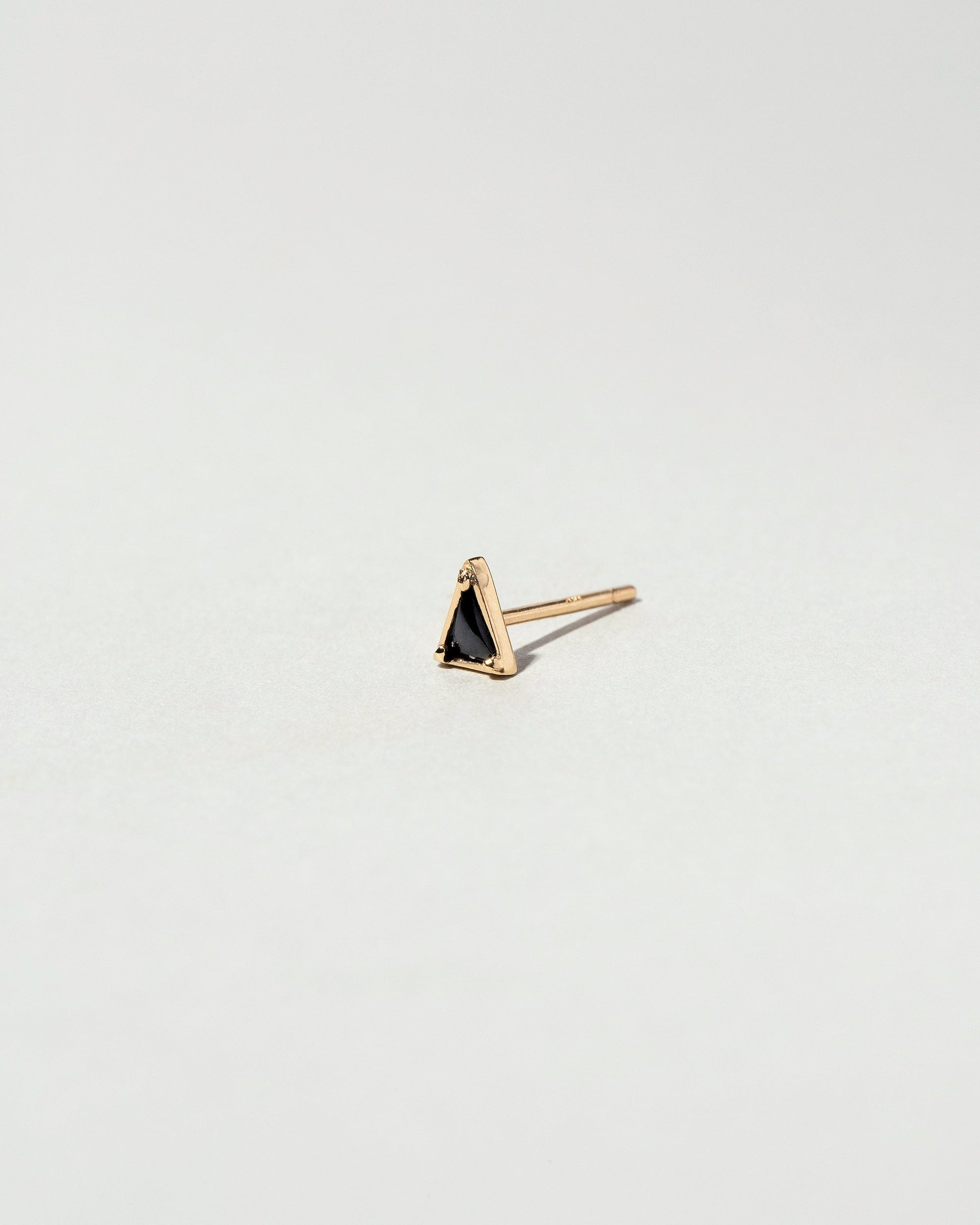  Triangle Single Stud on light color background.