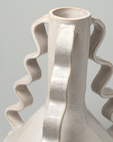 Detail view of Morgan Peck Pearl Swoop Vase on light color background.