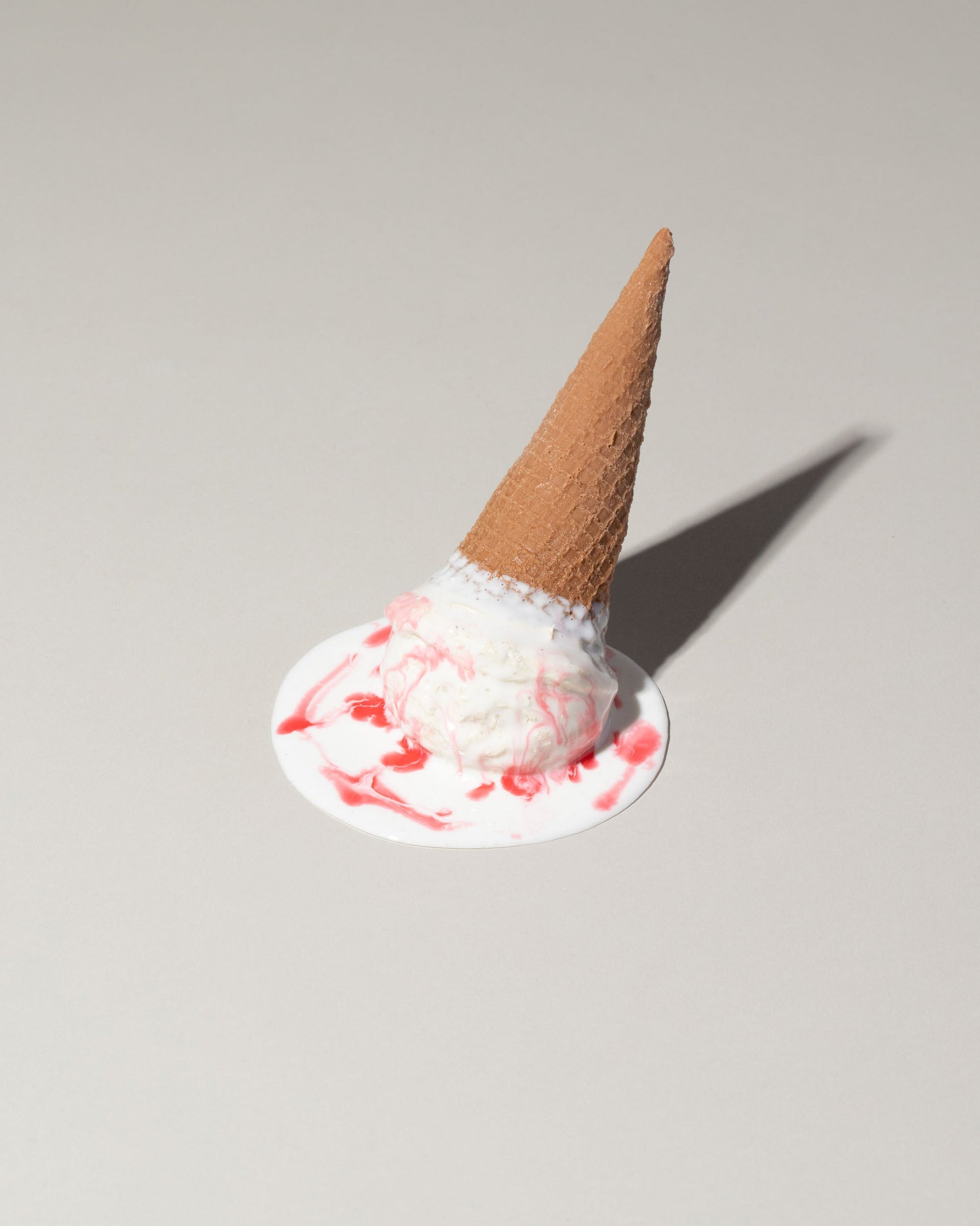 Spills Strawberry Ice Cream Spill on light color background.