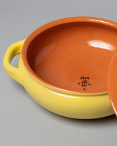  Detail view of Mazzotti 1903 Yellow and Orange Clay Pot on light color background.