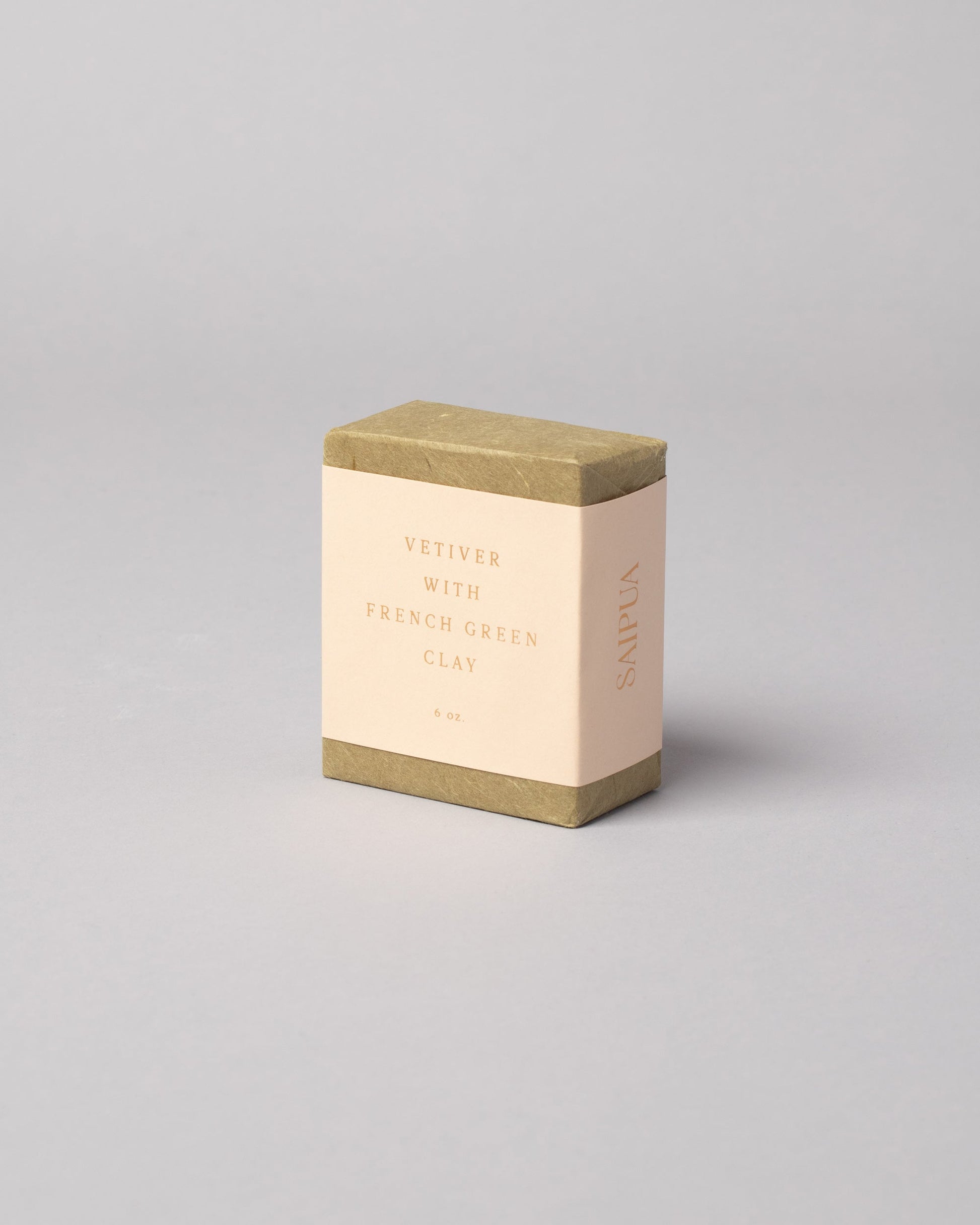 Saipua Vetiver with French Green Clay Soap on light color background.