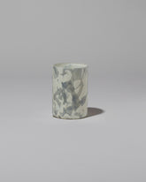 Stories of Italy Gray Nougat Glass Tumbler on light color background.