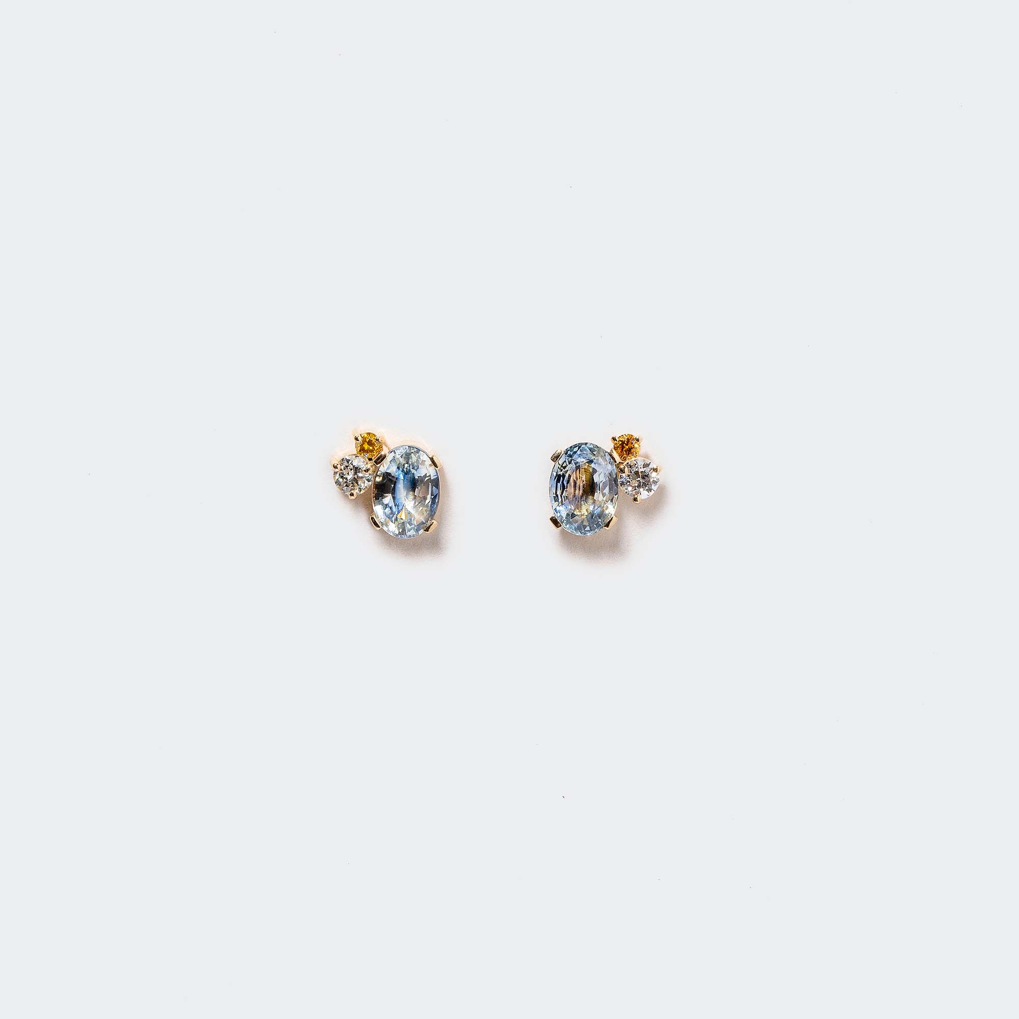 product_details:: Oscillating Earrings on light color background.