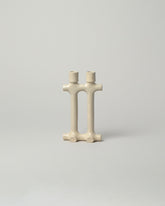  Pipe Candle Holders on light color background.