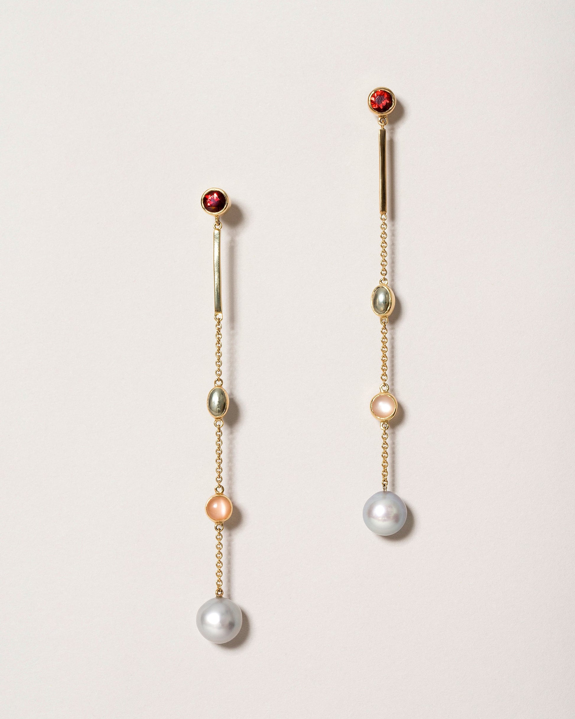  Act 2. Earrings 1 on light color background.