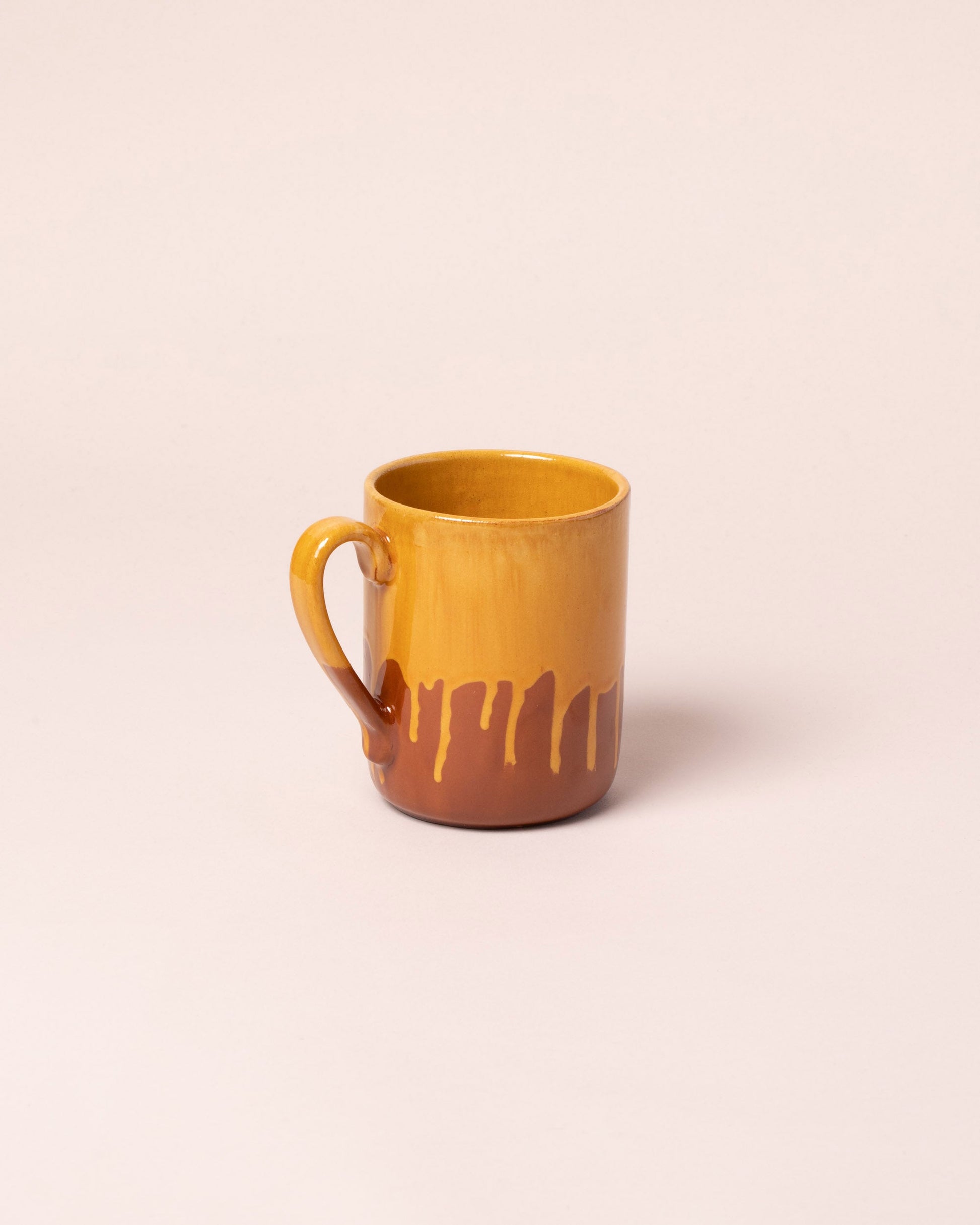 La Ceramica Vincenzo Del Monaco Caramel Yellow Coffee Mug on light color background.