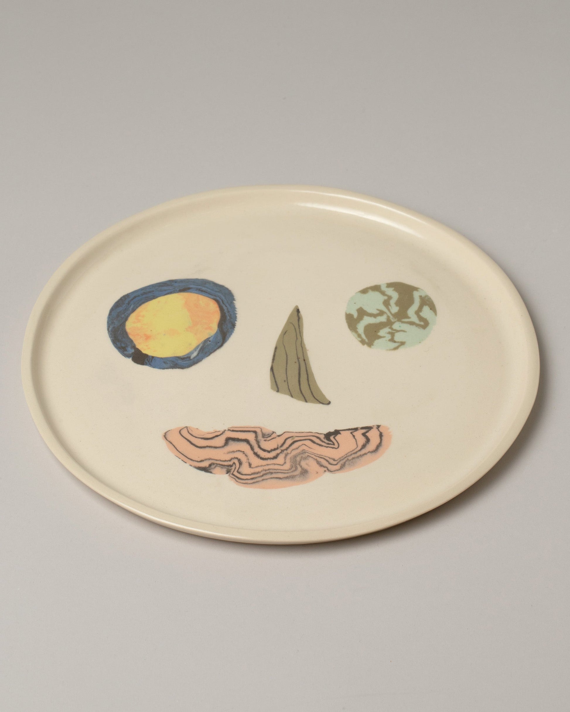E.E. Ceramics Serving Plate - Smiley on light color background.