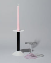 Group of Ichendorf Milano Medium White/Black and Small Pink/Clear/Grey Rainbow Candleholders on light color background.
