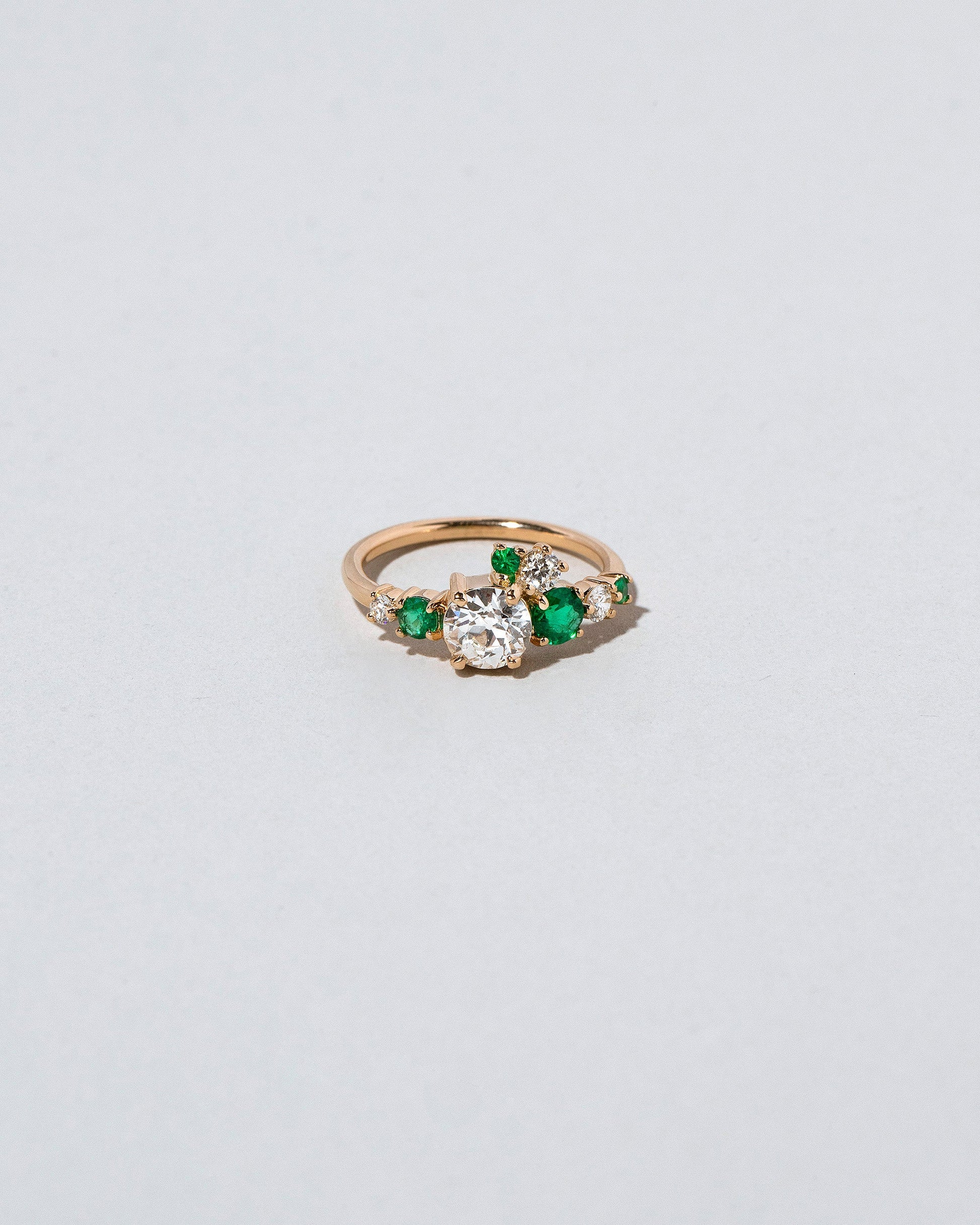  Luna Ring - White Diamond & Emerald on light color background.